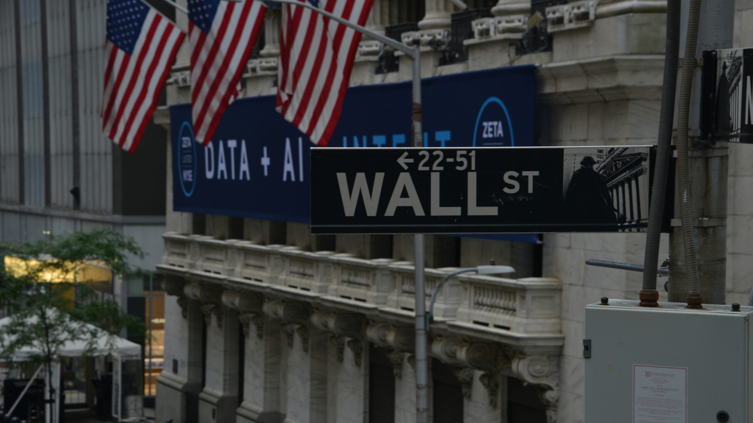 a street sign on wall street in new york city