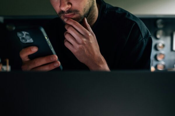 a man sitting in front of a laptop computer