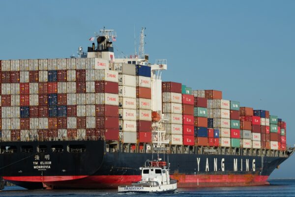black and red ship on body of water at daytime
