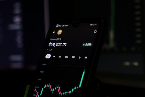a cell phone displaying a stock chart on the screen