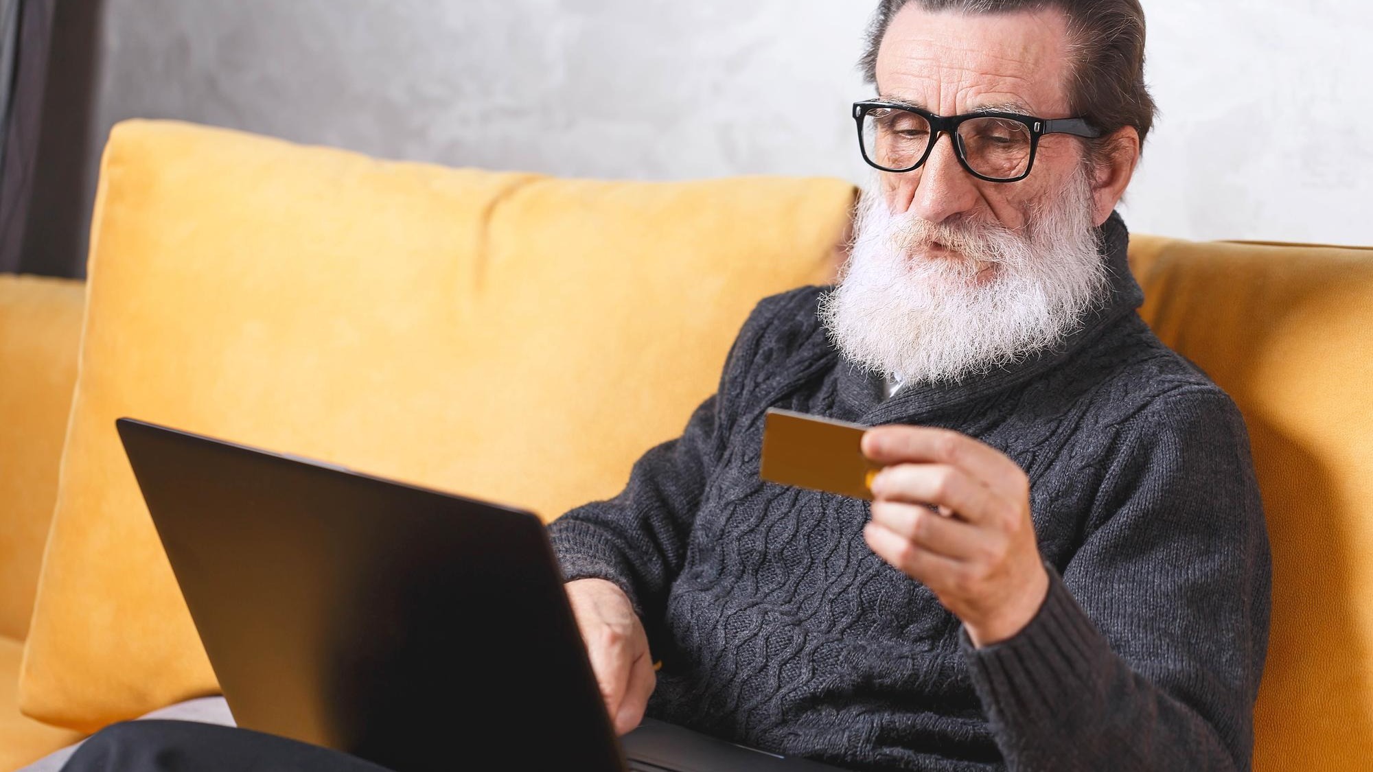 Cheerful senior bearded man in glasses