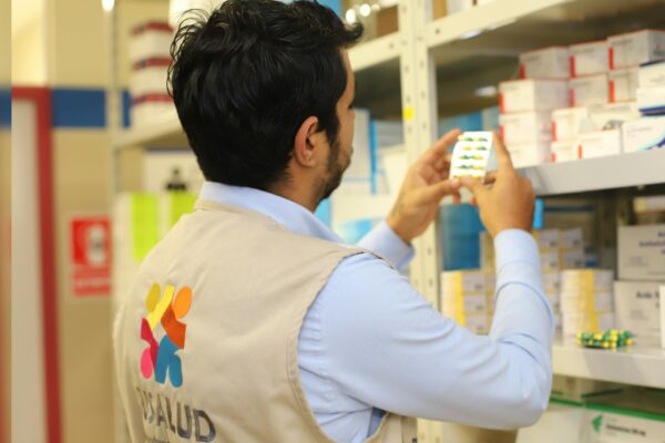 a man taking a picture of a product in a store