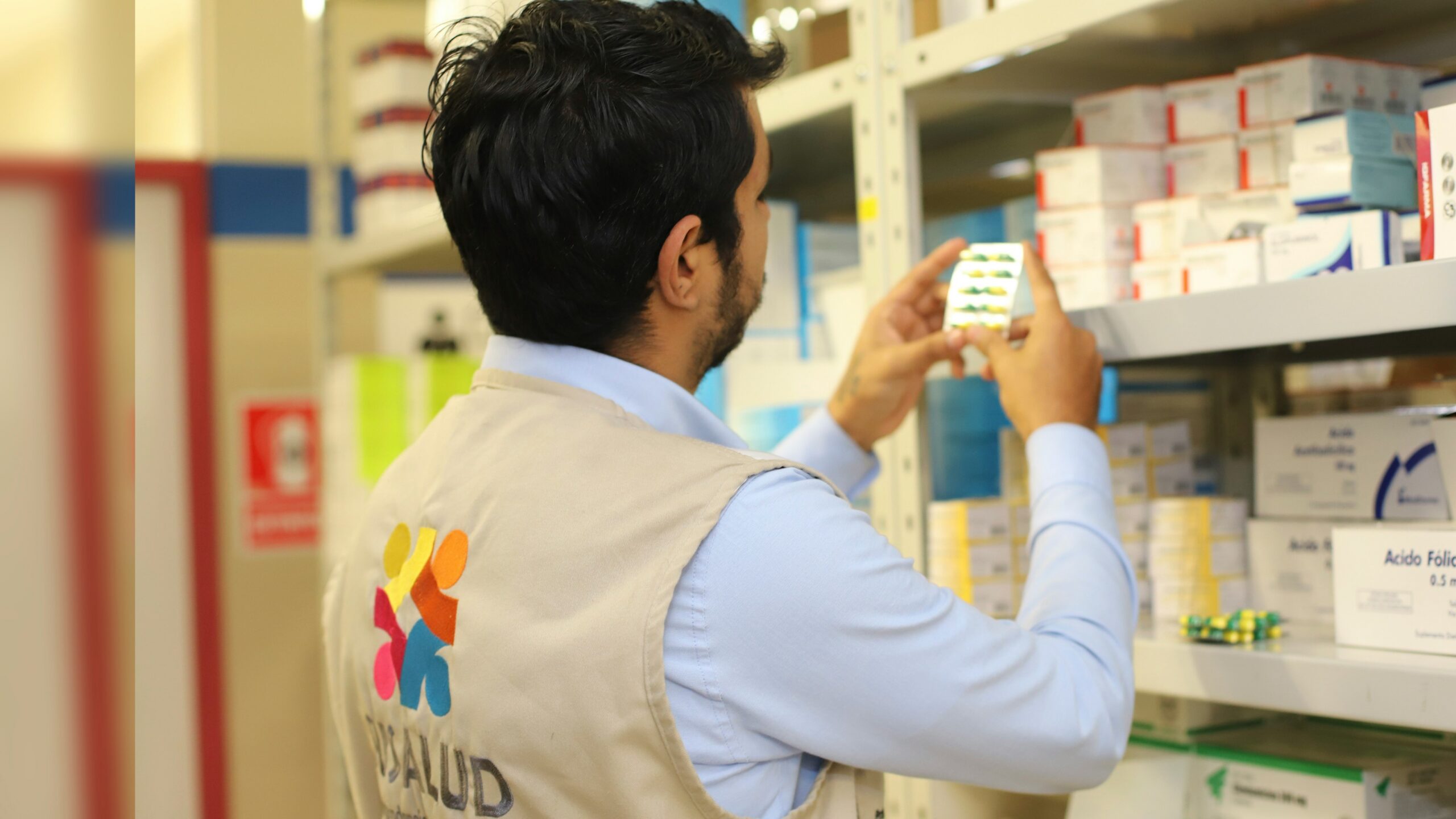 a man taking a picture of a product in a store