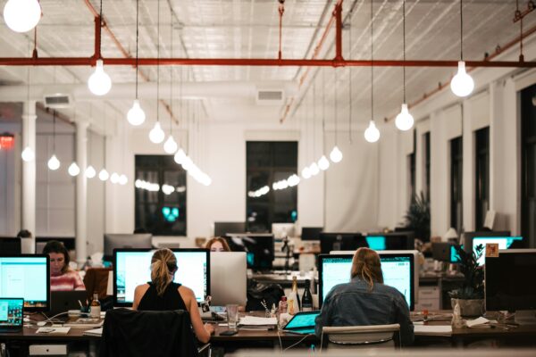 people sitting on chair in front of computer