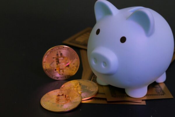 Piggy bank with bitcoin coins.