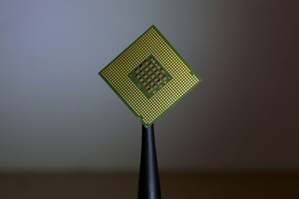 person holding computer cell processor