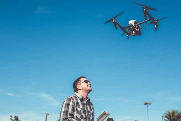 man flying drone