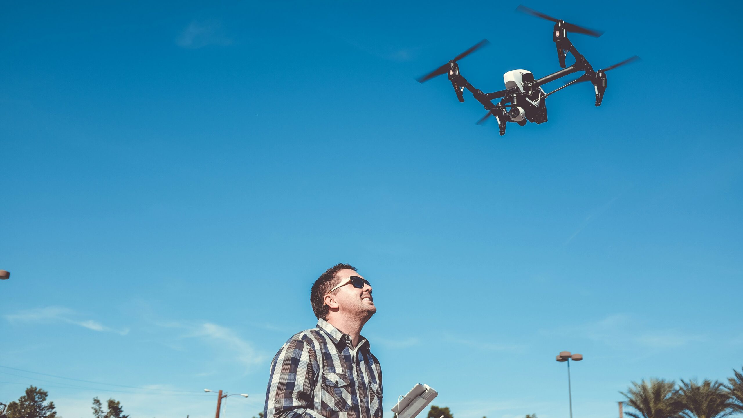 man flying drone