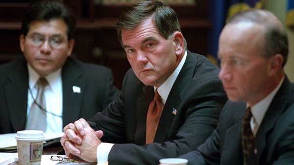 Tom Ridge, newly sworn-in director of the Office of Homeland Security, attends a meeting of senior White House staff, including, at left, Alberto R. Gonzalez, White House Counsel, and Mitchell Daniels, director of the Office of Management and Budget, in the Roosevelt Room. WHITE HOUSE PHOTO BY PAUL MORSE