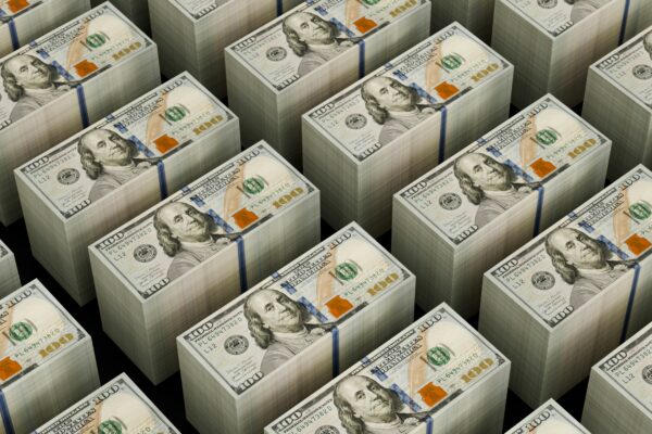 Stacks of hundred dollar bills are shown.