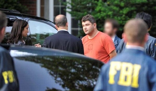 Richard Murphy is taken into custody by the FBI outside his Montclair, New Jersey, home.