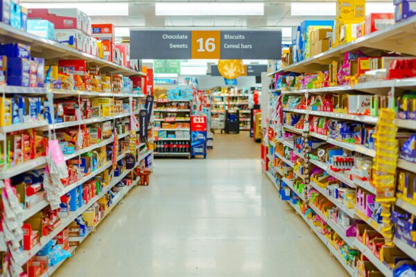 a grocery store aisle filled with lots of food