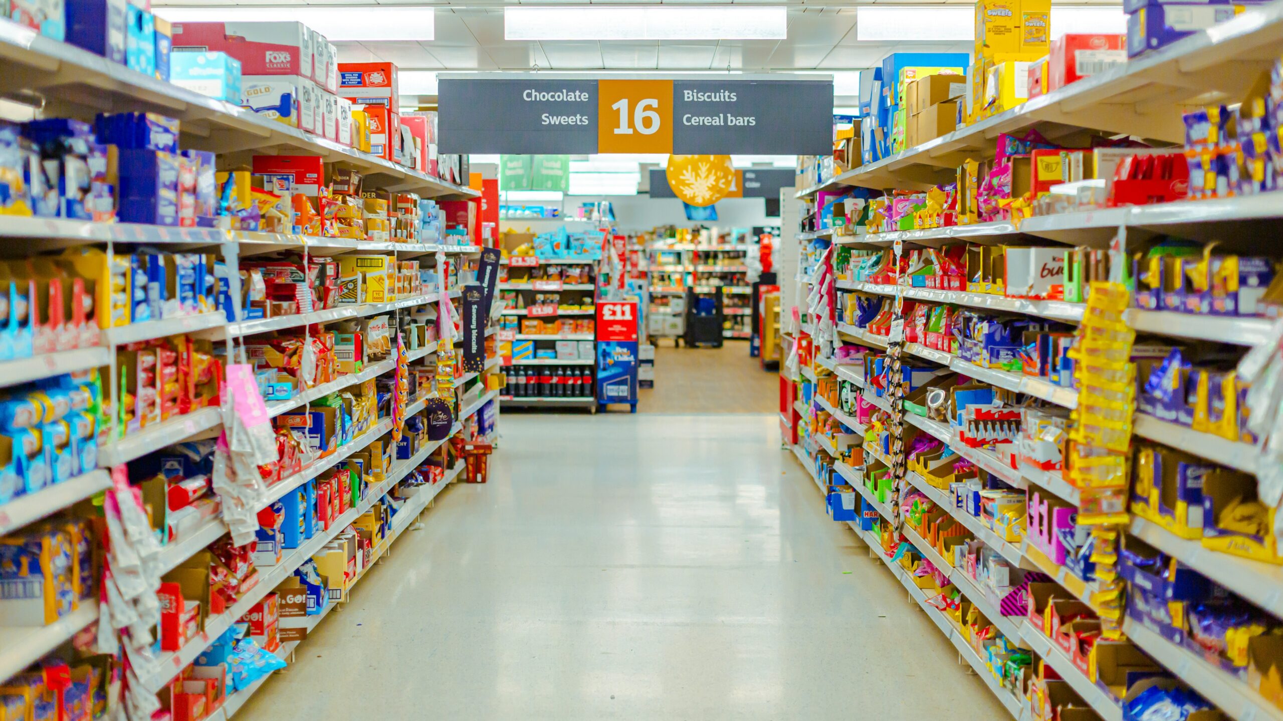 a grocery store aisle filled with lots of food