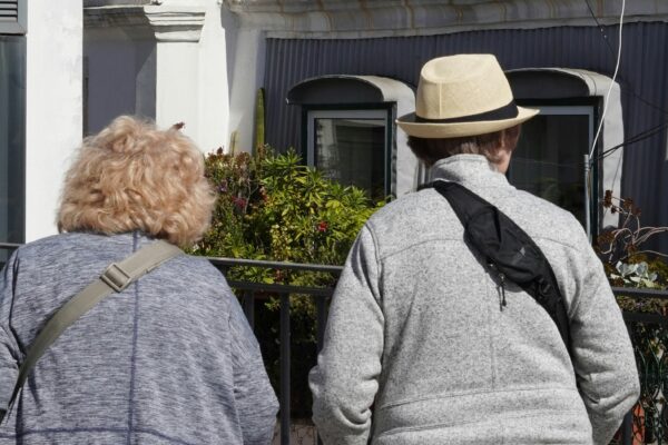 a couple of people that are walking down the street