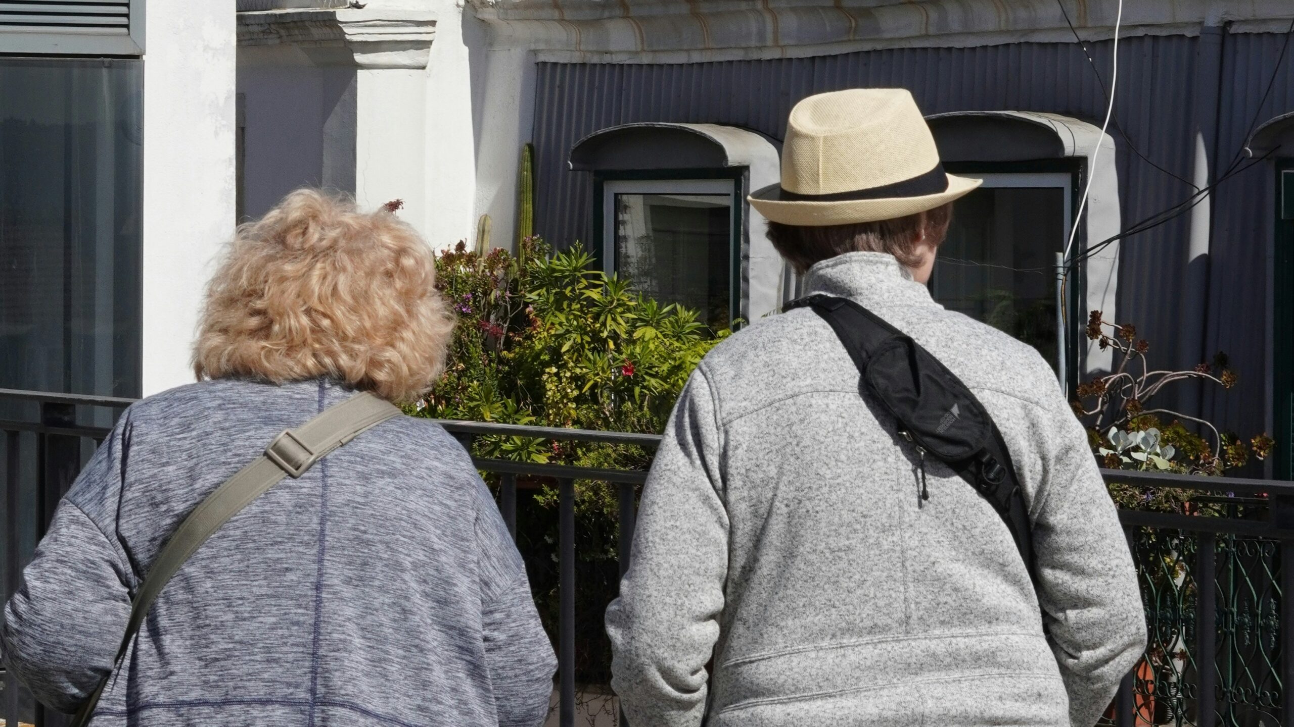 a couple of people that are walking down the street