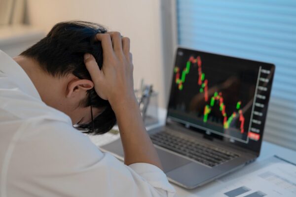 Asian businessman In the Data Mining Center Statistician with Monitors Displaying business finance technology and investment Stock Market Investments