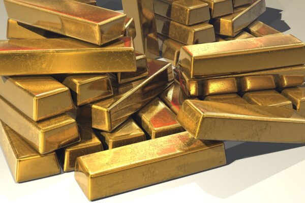 A pile of lustrous gold bars symbolizing wealth and prosperity.