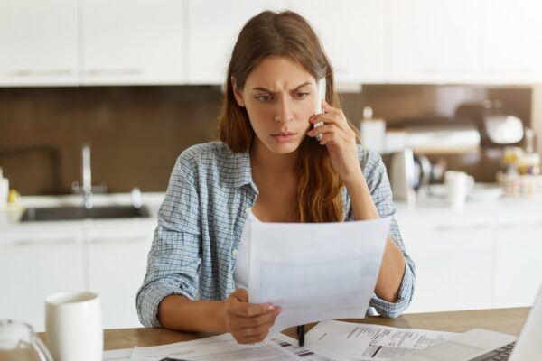 Young woman checking her budget and doing taxes