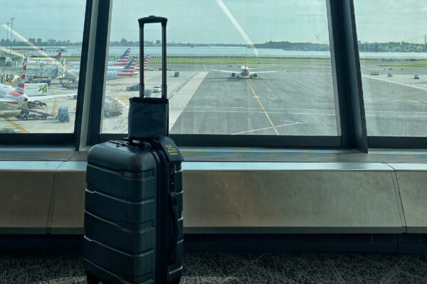 a suitcase sits on a window sill