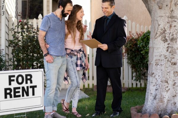 Couple signing papers fr new house
