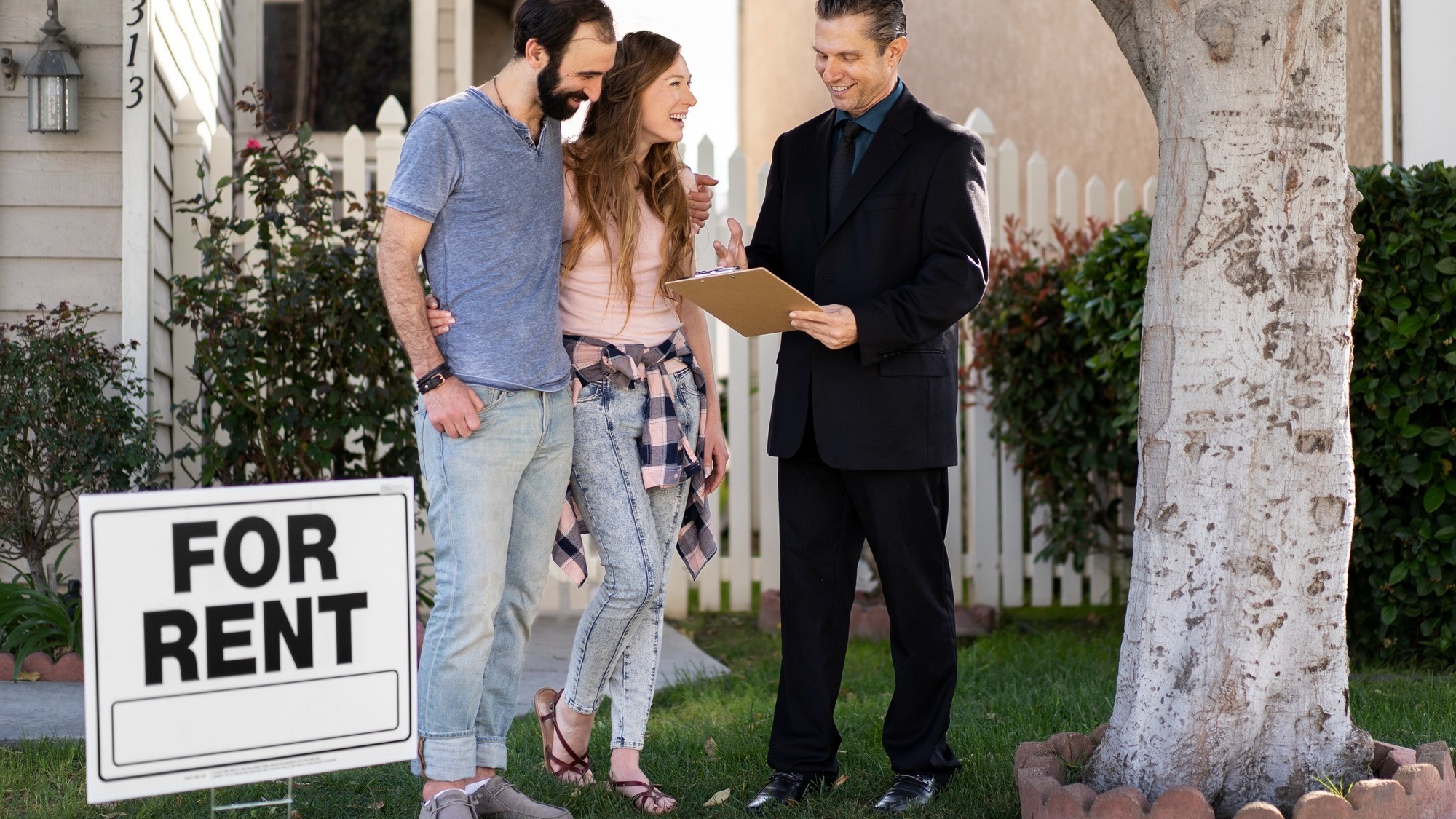 Couple signing papers fr new house