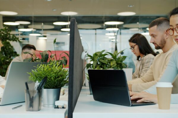 People working at desks in a modern office.