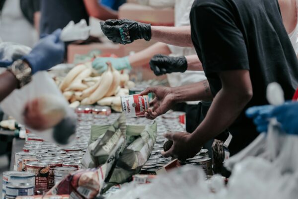 volunteers sorting canned food donations