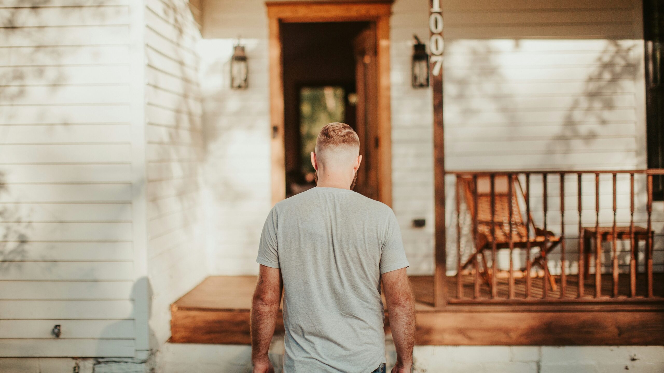 A man standing in front of a house