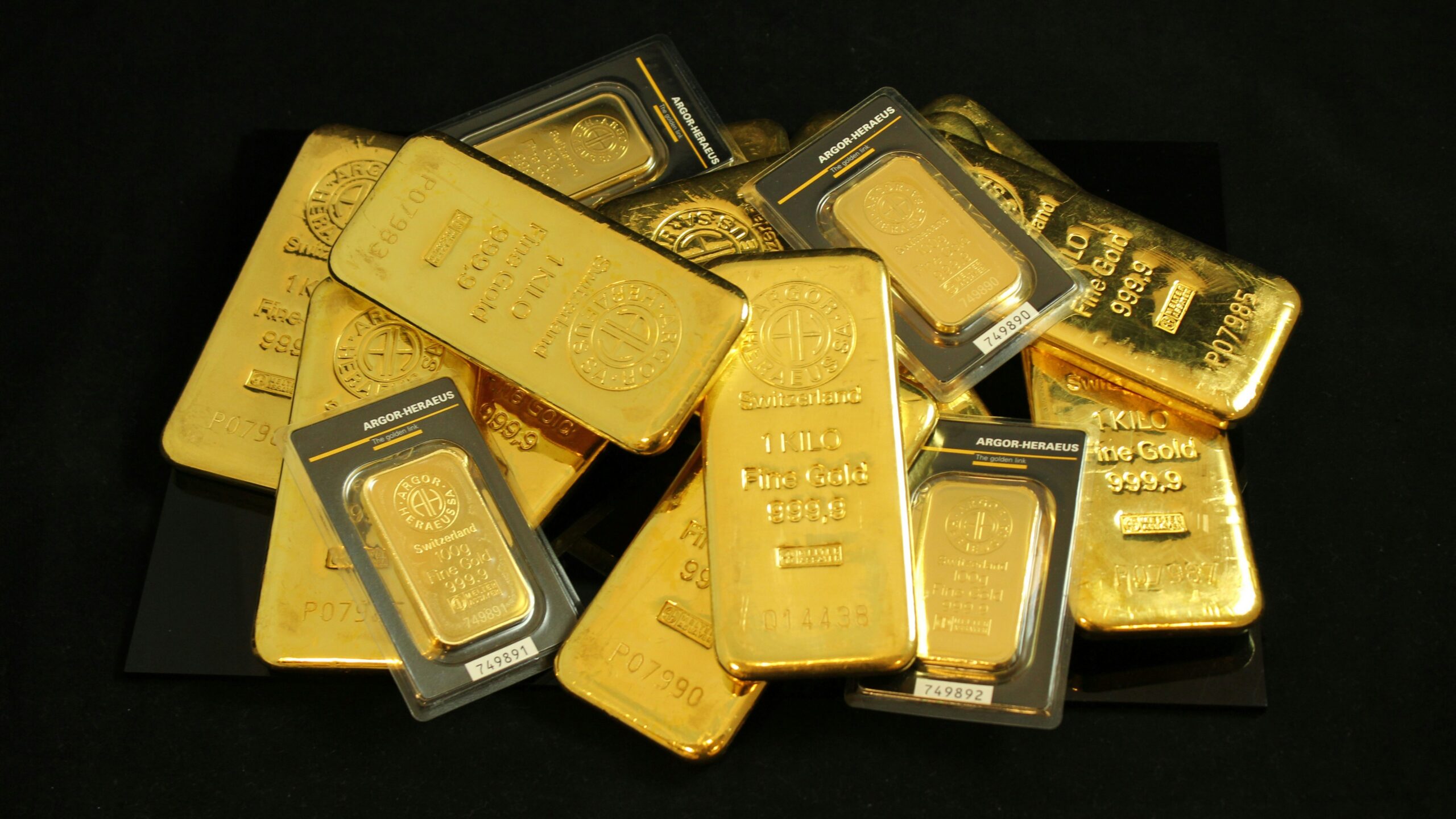 a pile of gold bars sitting on top of a table