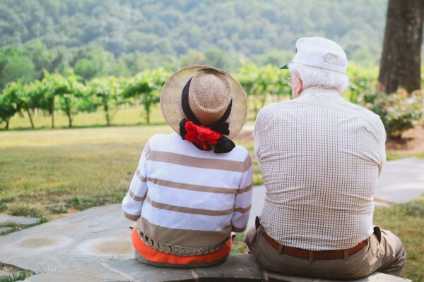 couple sitting on pathway