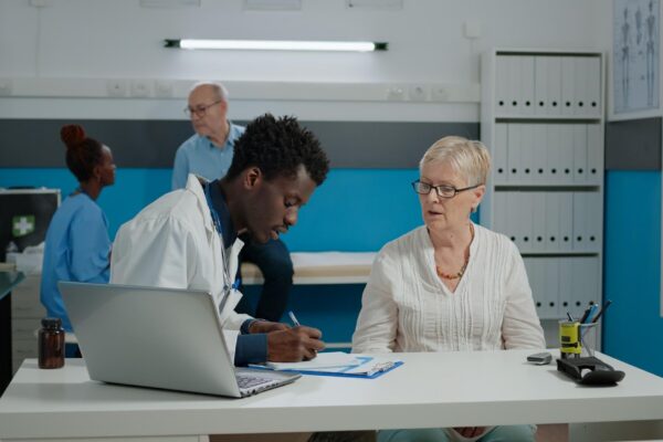 People working on table in office