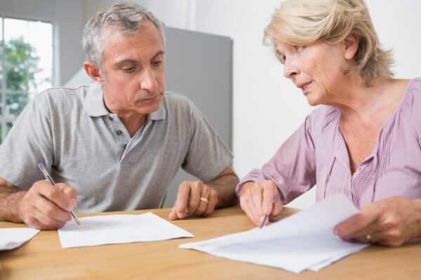 Couple discussing with documents