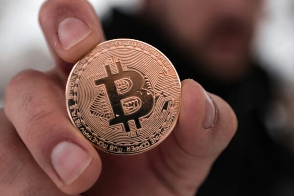 a person holding a coin