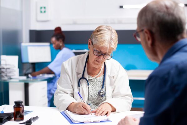 Doctor writing medical instructions