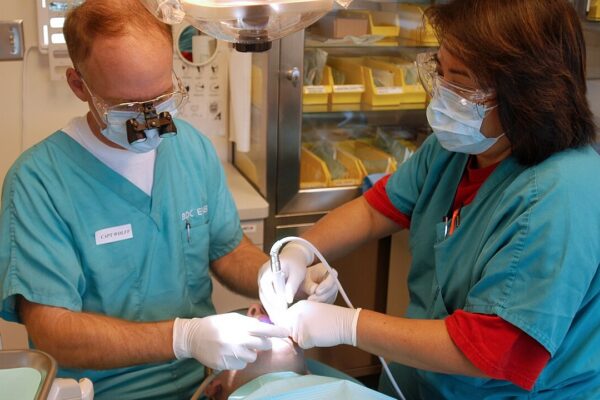 Everett, Wash. (Oct. 19, 2005) – U.S. Navy Capt. Wolff performs a routine cleaning on a patient at the Dental Department of Naval Station Everett Health Clinic. U.S. Navy photo by Photographer's Mate 3rd Class Jacob J. Kirk (RELEASED)