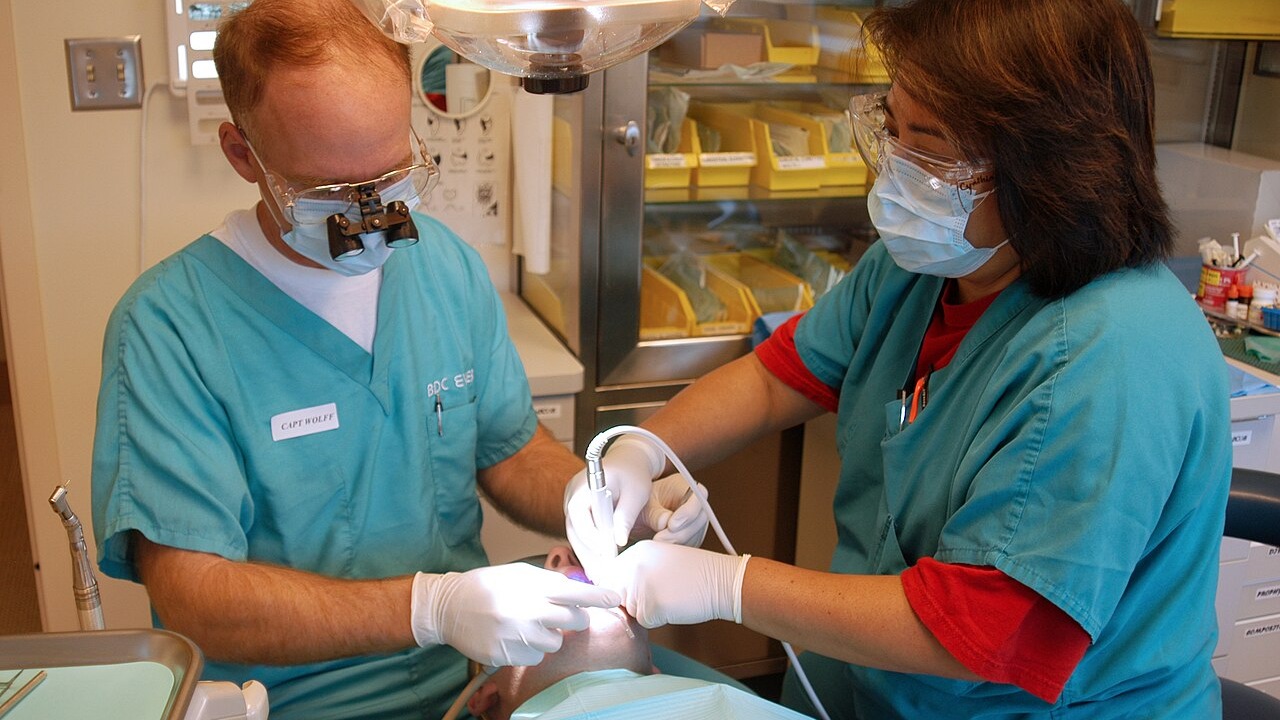 Everett, Wash. (Oct. 19, 2005) – U.S. Navy Capt. Wolff performs a routine cleaning on a patient at the Dental Department of Naval Station Everett Health Clinic. U.S. Navy photo by Photographer's Mate 3rd Class Jacob J. Kirk (RELEASED)
