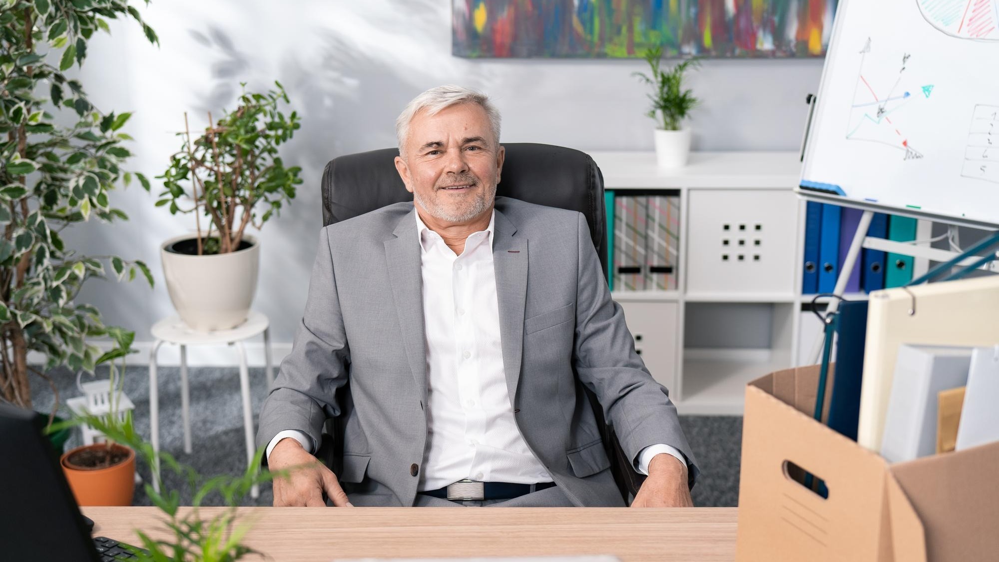 Sympathetic handsome older man boss manager of company