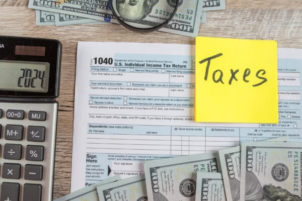 1040 tax form on a wooden table Tax time Financial concept