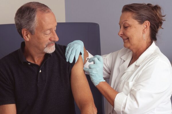 Title Nurse Administers a Vaccine Description A female nurse administers a vaccine into a male patient's arm as he watches. Topics/Categories People -- Adult People -- Health Professional and Patient Test or Procedure -- Lab Tests Type Color, Photo Source National Cancer Institute (NCI)