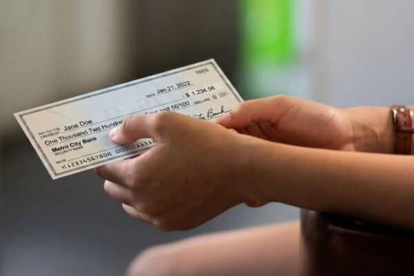 person holding white printer paper