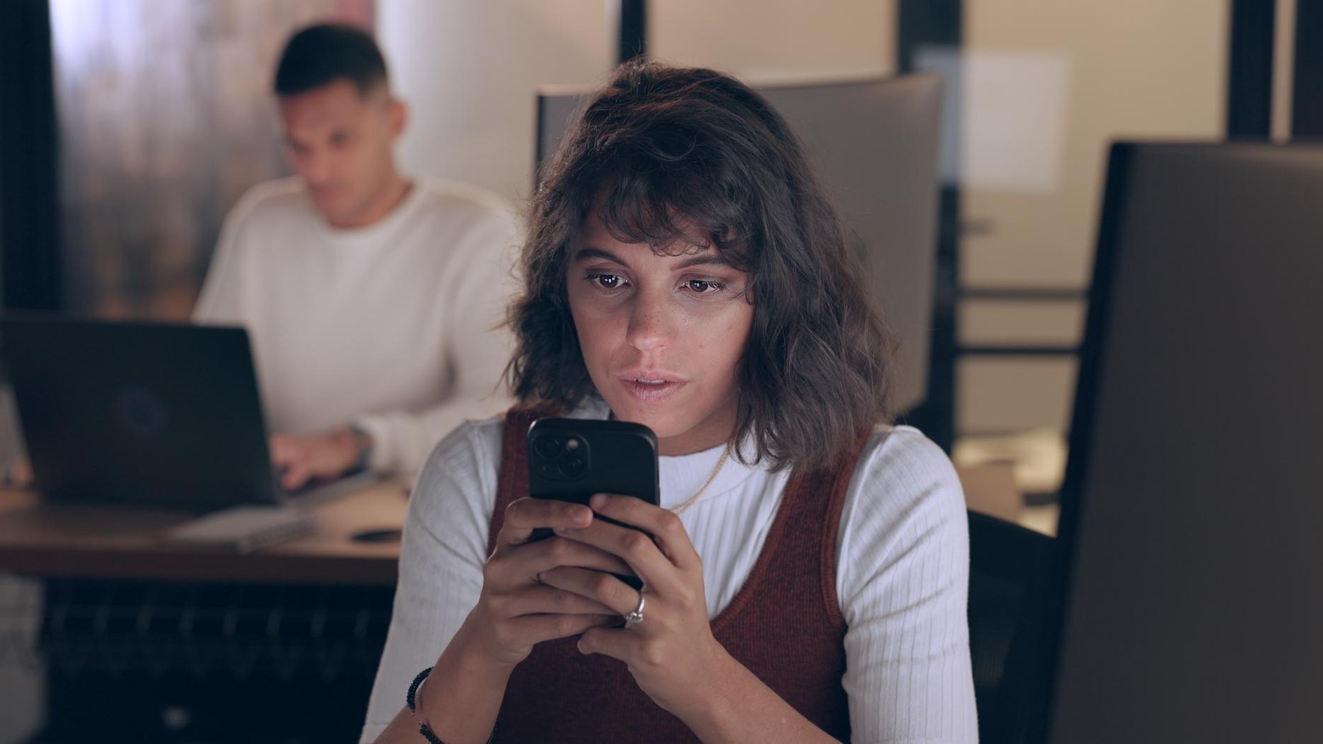 Smartphone office and business woman with social media networking feedback and online review of data analytics seo and app management Focus typing and digital marketing worker on cellphone chat
