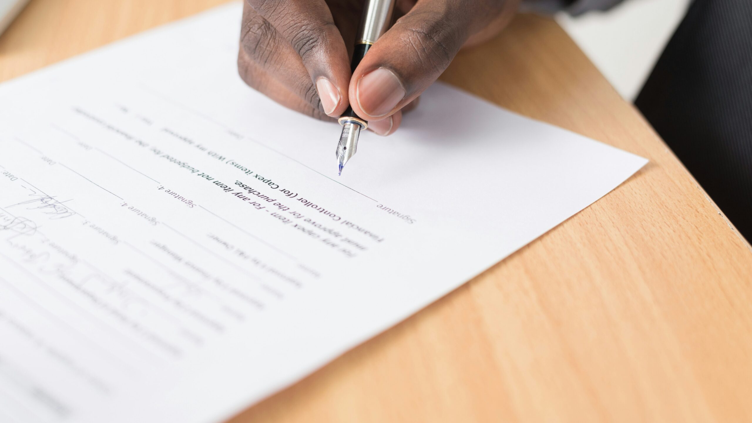person writing on white paper