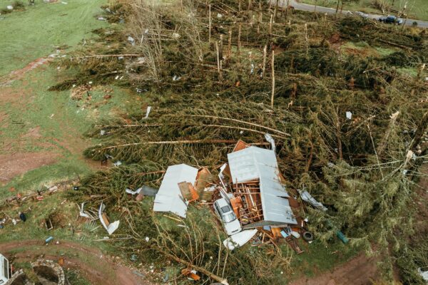 a house that has been torn down in the middle of a field