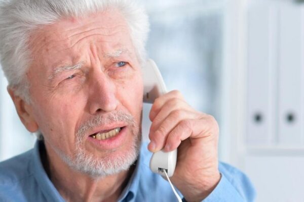 An elderly couple is sick and takes medication at home