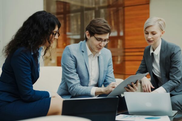 Three business people collaborating on a project