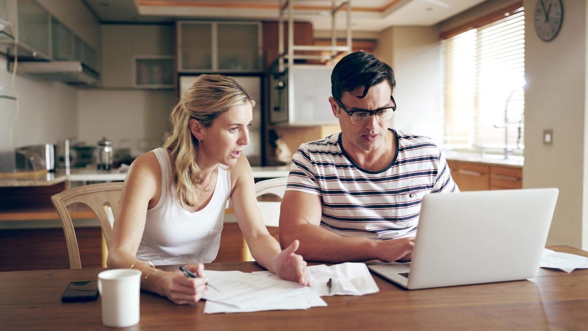 Finance problem and couple with laptop with bills stress and internet banking issue in debt Home payment due and anxiety from mortgage tax audit or invoice with conversation about savings
