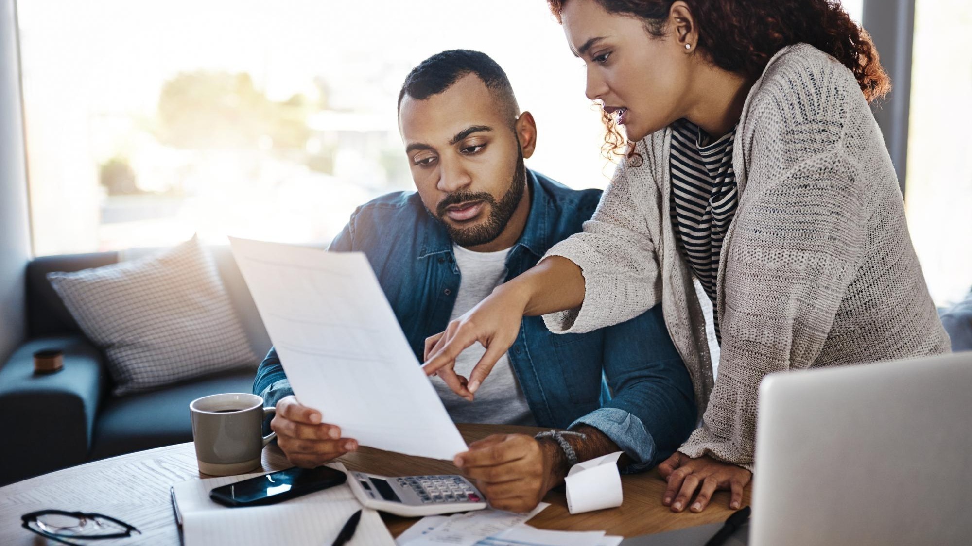 Talking finance budget or couple with invoice paperwork or taxes documents for planning savings Investment rent or people organizing bills checklist for paying debt or financial household expenses