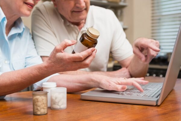 Senior couple looking up medication online