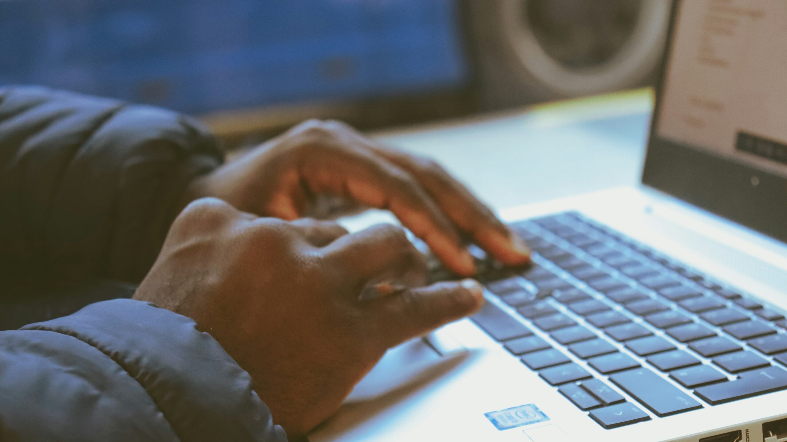 a person typing on a laptop
