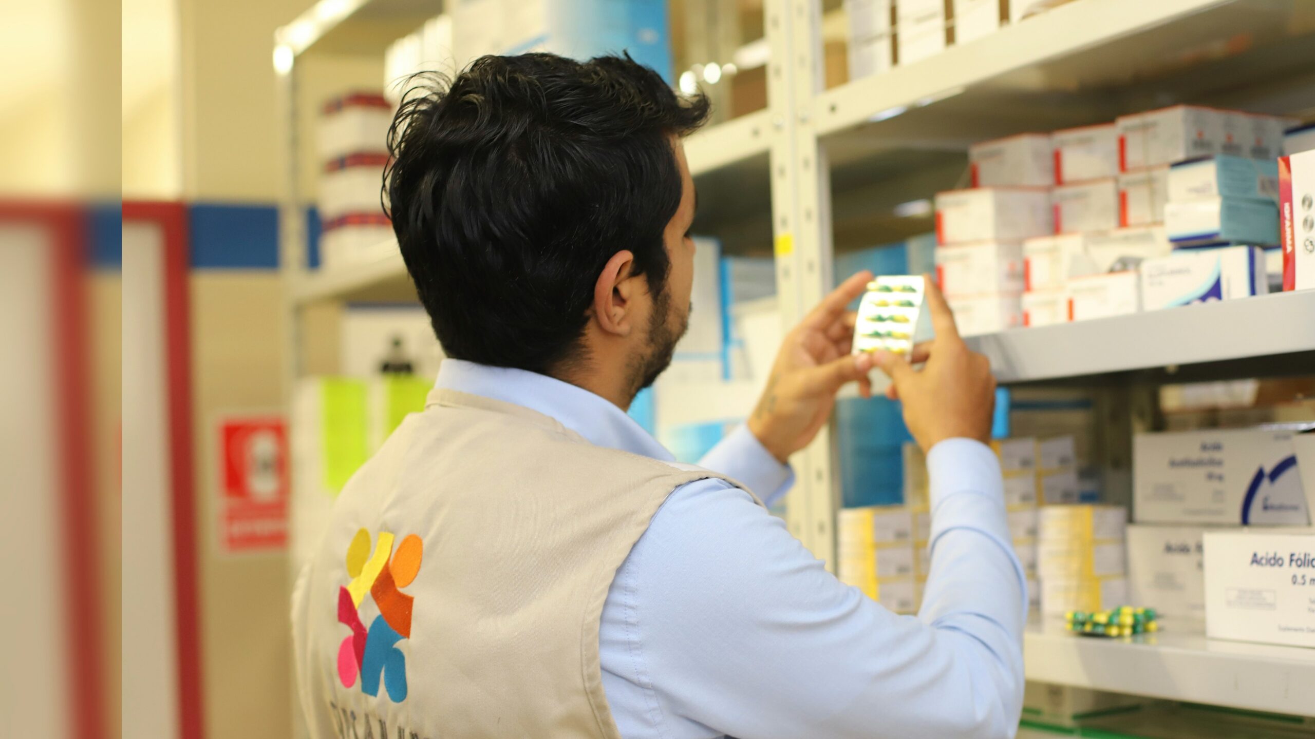 a man taking a picture of a product in a store